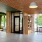 lobby with large tree and bookcase