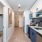 galley kitchen alongside bedroom