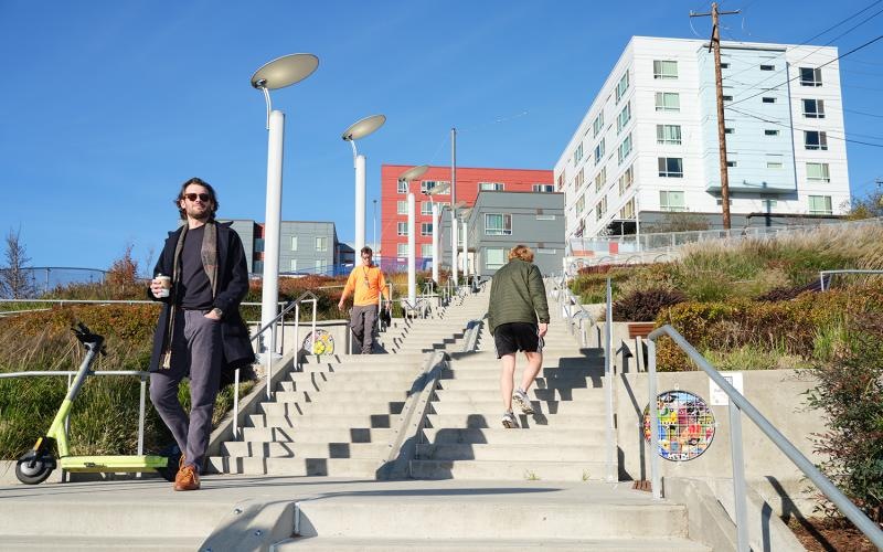 a group of people walking up stairs